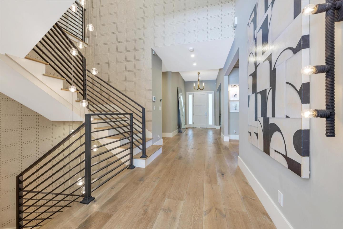 455 San Mateo Drive Menlo Park, CA 94025 - Photo 12 of 37 a view of a hallway with wooden floor and staircase
