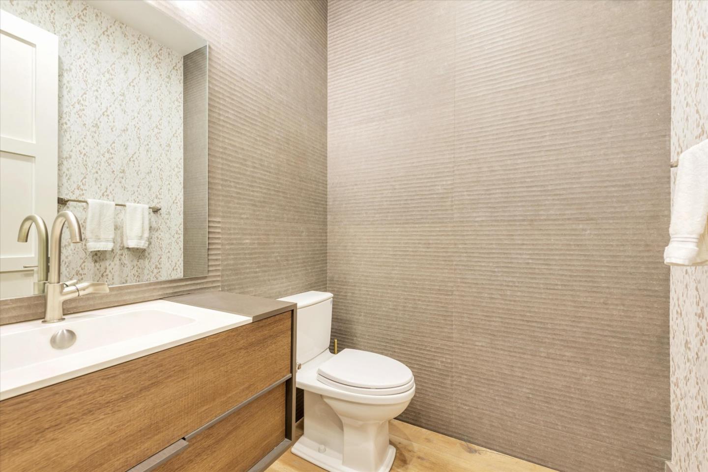 455 San Mateo Drive Menlo Park, CA 94025 - Photo 13 of 37 a bathroom with a sink a toilet and a mirror