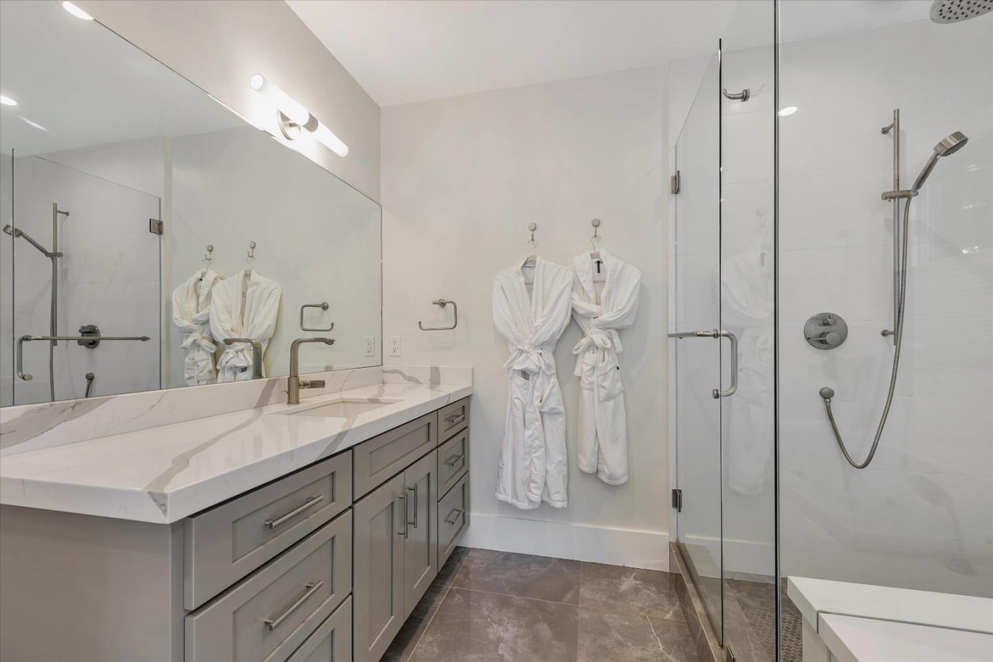 455 San Mateo Drive Menlo Park, CA 94025 - Photo 16 of 37 a bathroom with a double vanity sink mirror and shower
