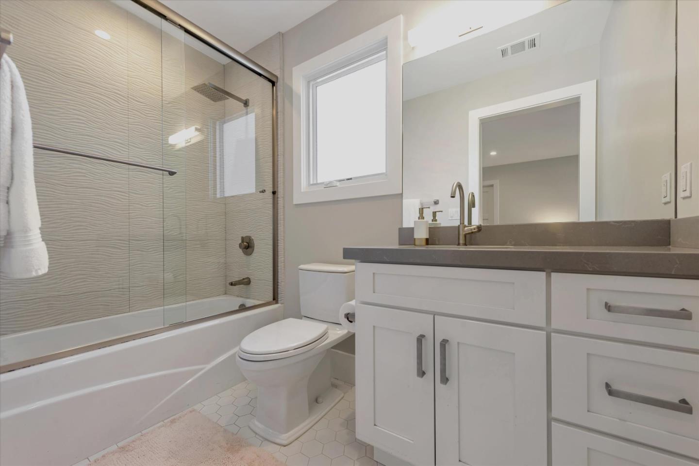 455 San Mateo Drive Menlo Park, CA 94025 - Photo 19 of 37 a bathroom with a sink a toilet and shower