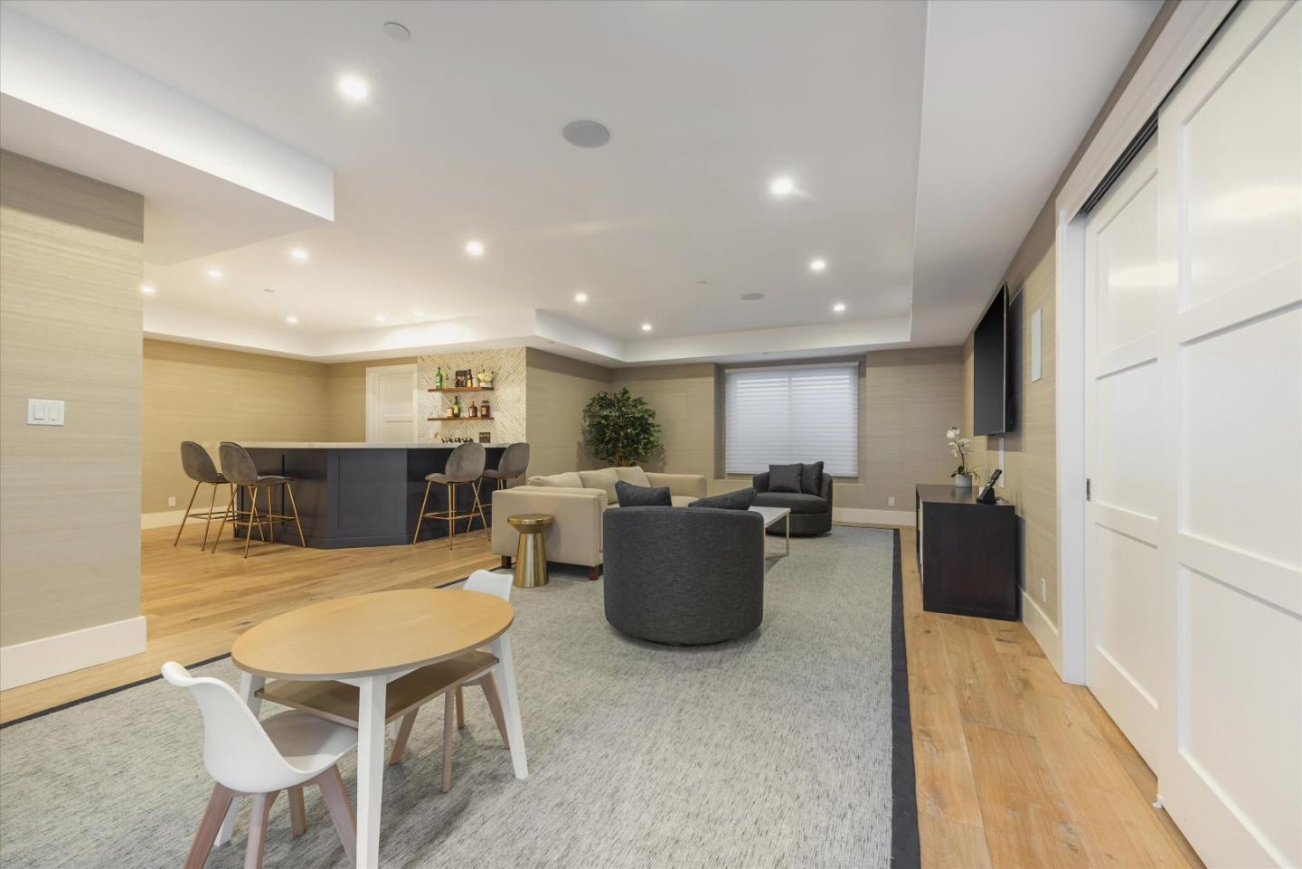 455 San Mateo Drive Menlo Park, CA 94025 - Photo 23 of 37 a living room with furniture a two couches and a dining table with wooden floor