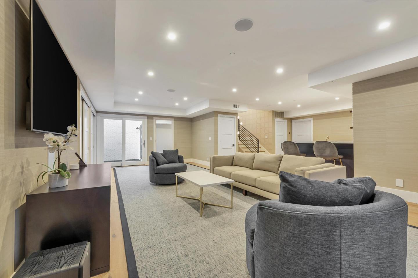 455 San Mateo Drive Menlo Park, CA 94025 - Photo 24 of 37 a living room with furniture and a flat screen tv