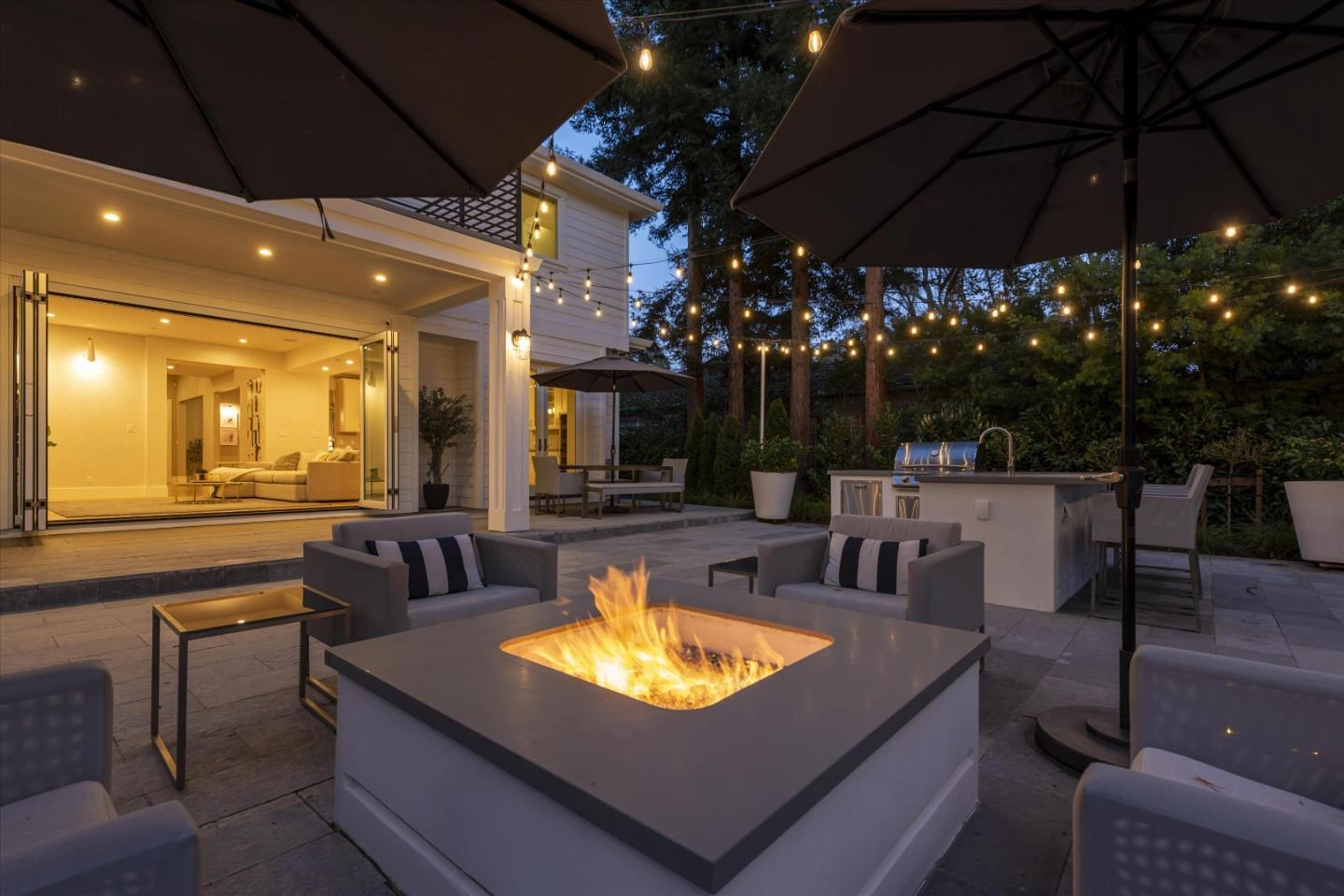 455 San Mateo Drive Menlo Park, CA 94025 - Photo 32 of 37 a view of a patio with a table and chairs under an umbrella