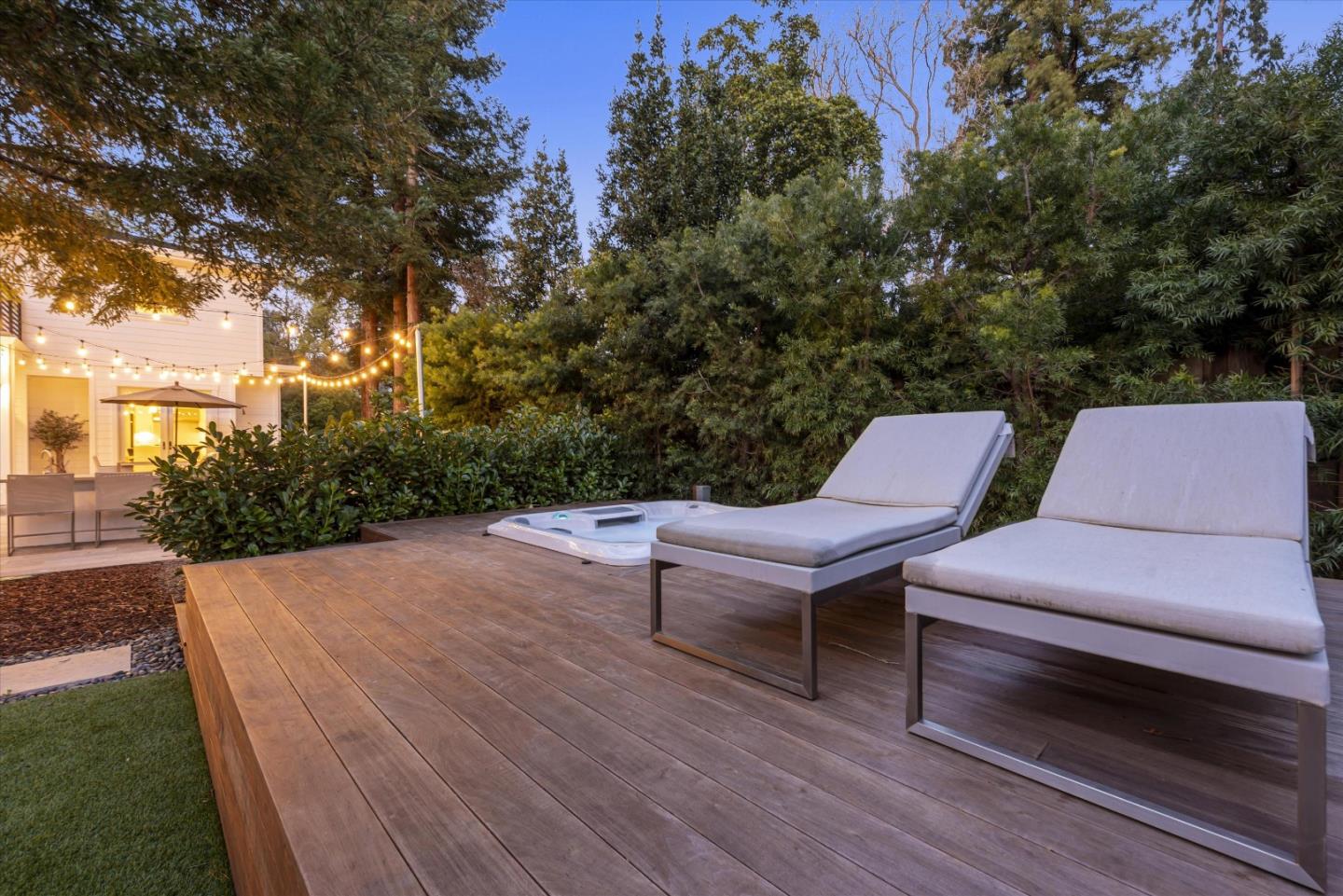 455 San Mateo Drive Menlo Park, CA 94025 - Photo 33 of 37 a backyard of a house with wooden floor and outdoor seating