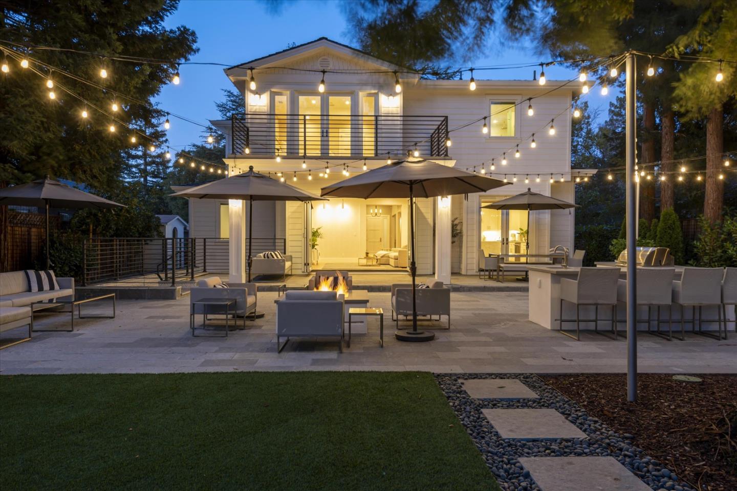 455 San Mateo Drive Menlo Park, CA 94025 - Photo 35 of 37 a view of a patio with dining table and chairs with a fire pit