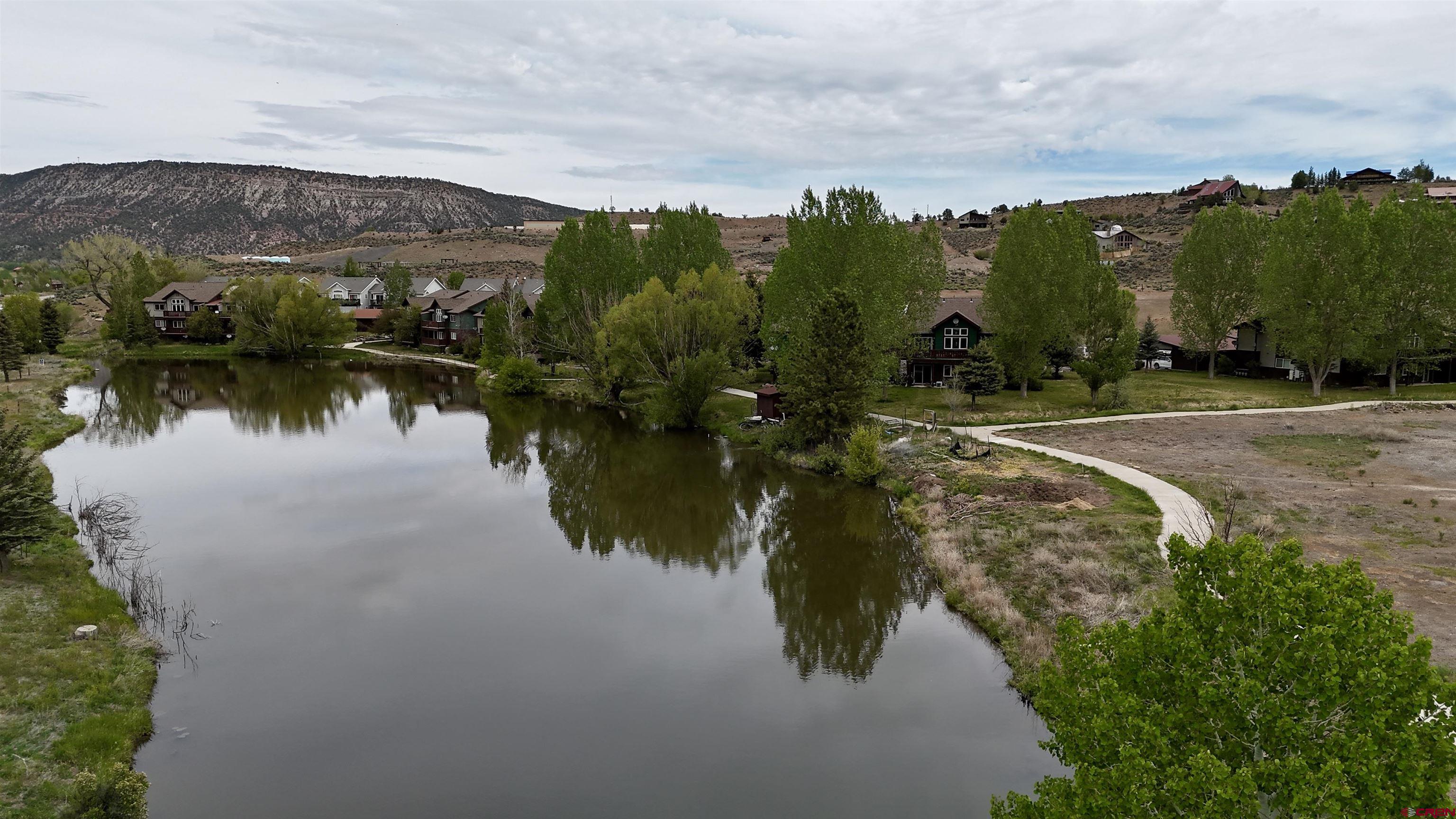 540 Redcliff Circle, Unit E 203 Ridgway, CO 81432 - Photo 35 of 36 a view of a lake with a mountain in the background