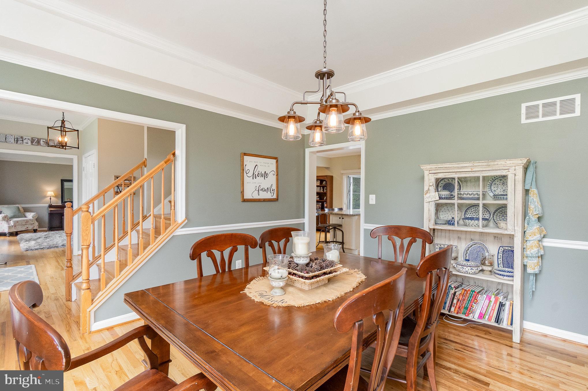 523 Copeland Road Fallston, MD 21047 - Photo 20 of 72 a view of a dining room with furniture a chandelier and wooden floor