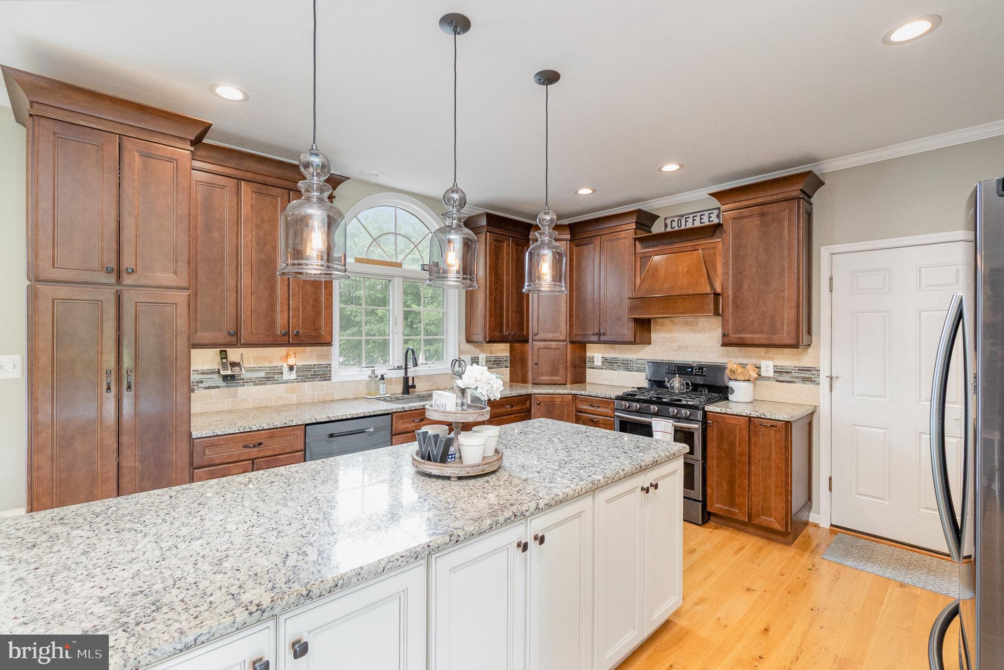 523 Copeland Road Fallston, MD 21047 - Photo 24 of 72 a kitchen with stainless steel appliances granite countertop a sink a stove and a refrigerator