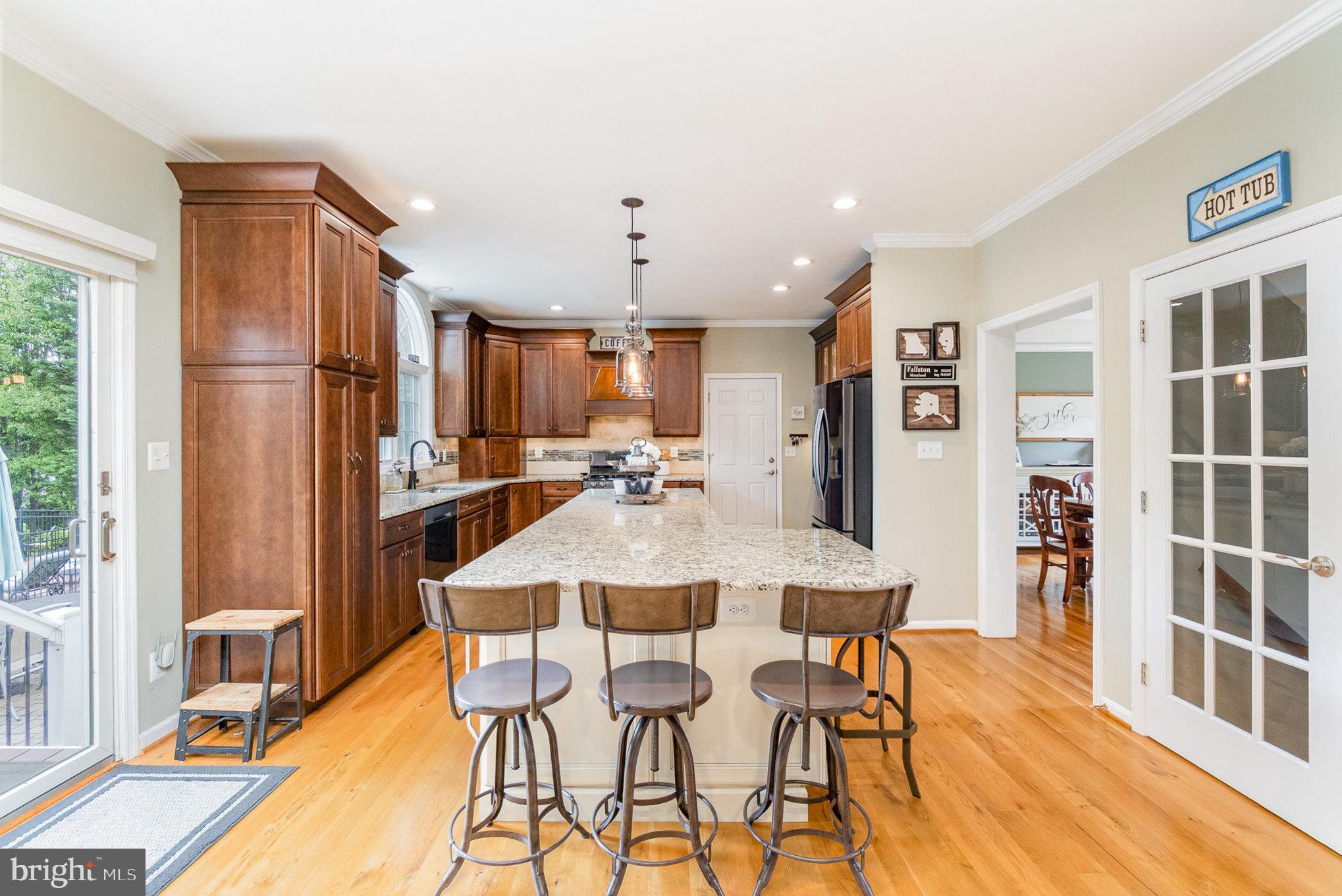 523 Copeland Road Fallston, MD 21047 - Photo 26 of 72 a kitchen with stainless steel appliances a dining table chairs and refrigerator