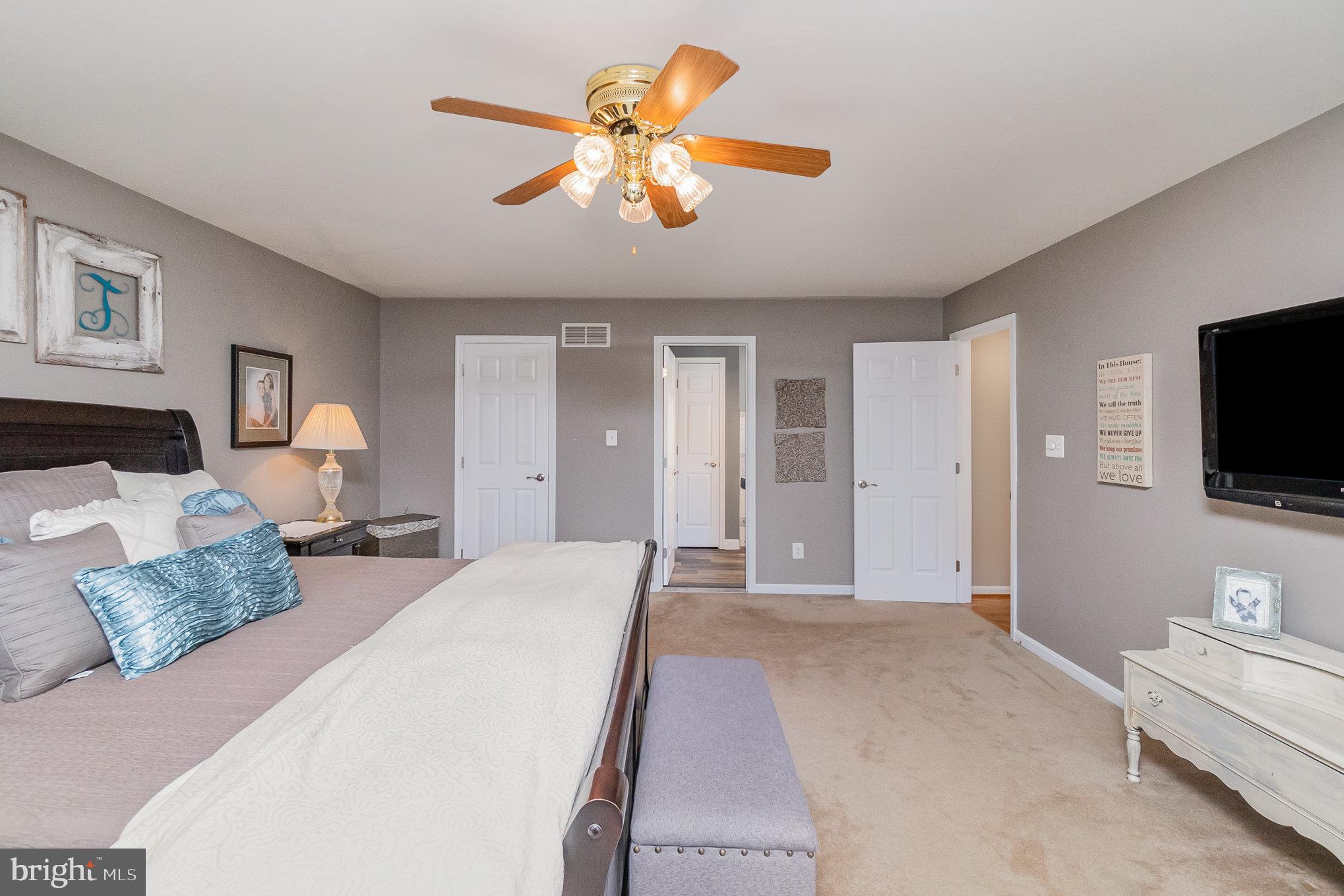 523 Copeland Road Fallston, MD 21047 - Photo 39 of 72 a spacious bedroom with a bed and a flat screen tv