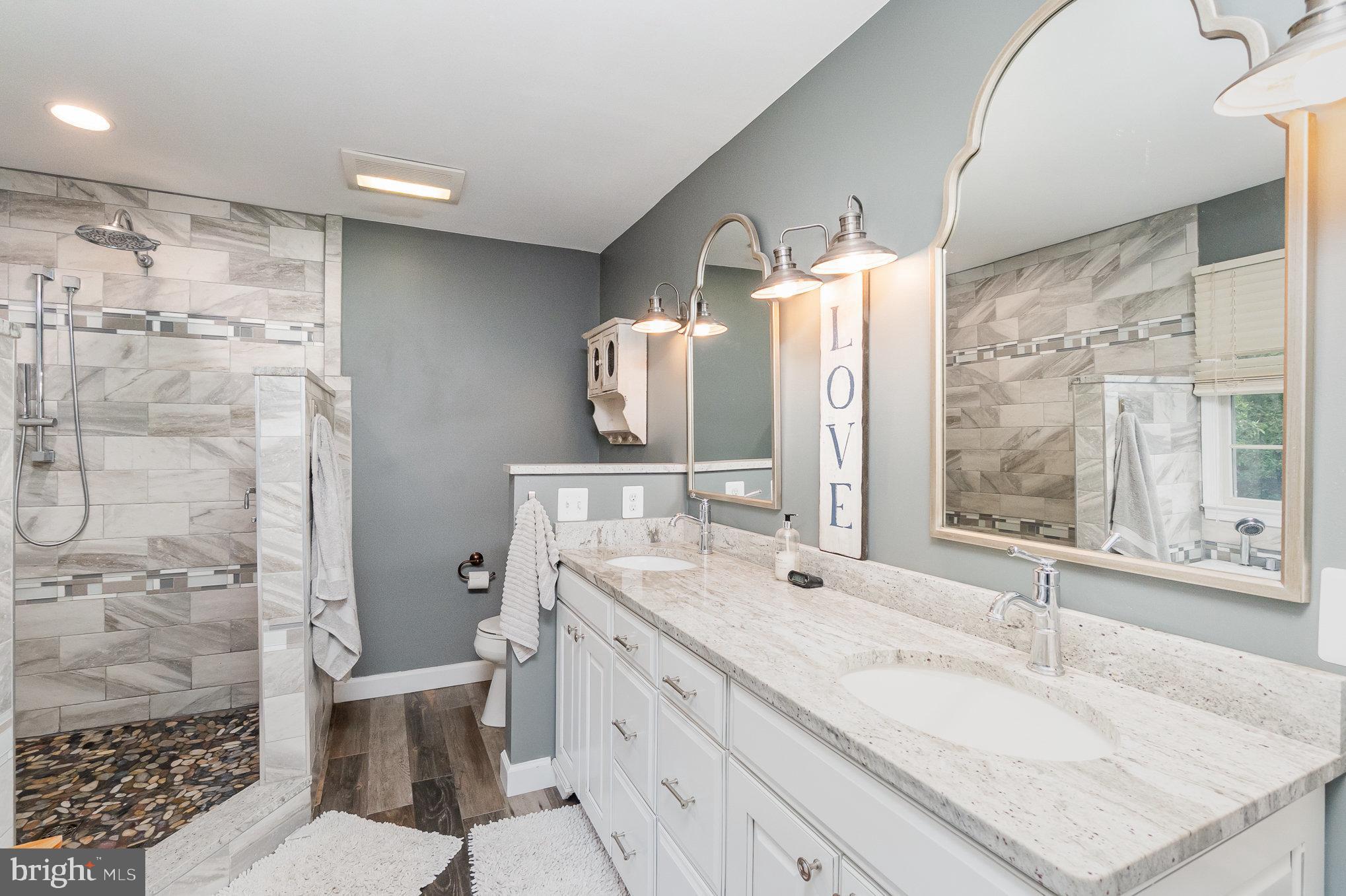523 Copeland Road Fallston, MD 21047 - Photo 42 of 72 a bathroom with a granite countertop sink mirror vanity and toilet