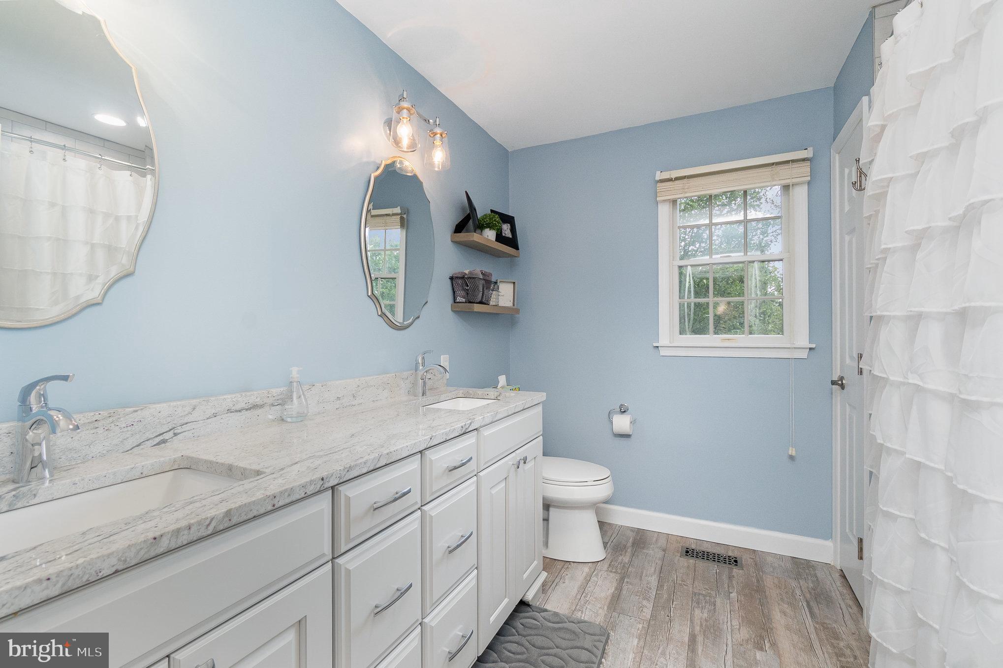 523 Copeland Road Fallston, MD 21047 - Photo 50 of 72 a bathroom with a granite countertop sink mirror vanity and a toilet