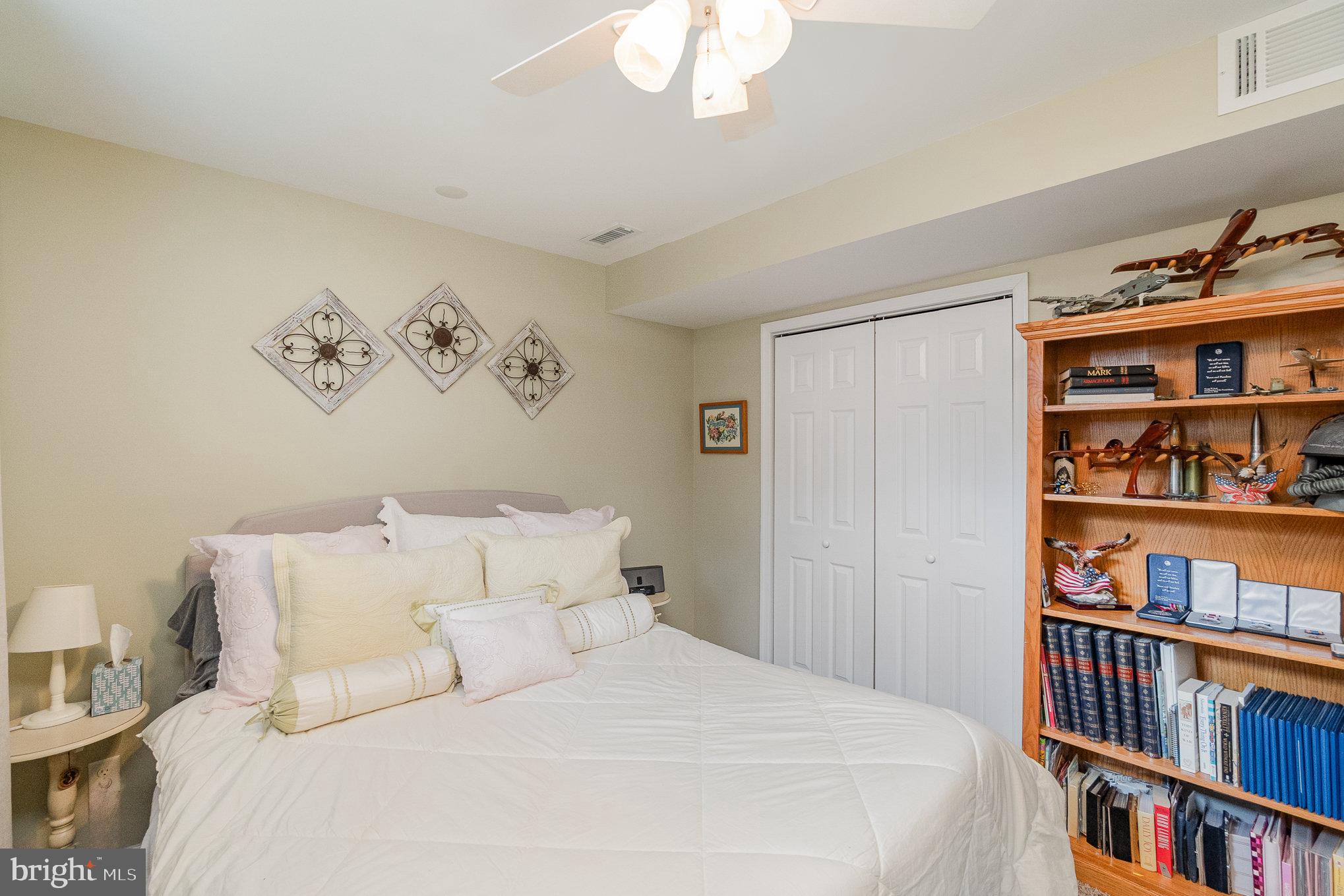 523 Copeland Road Fallston, MD 21047 - Photo 61 of 72 a bedroom with a bed and a book shelf