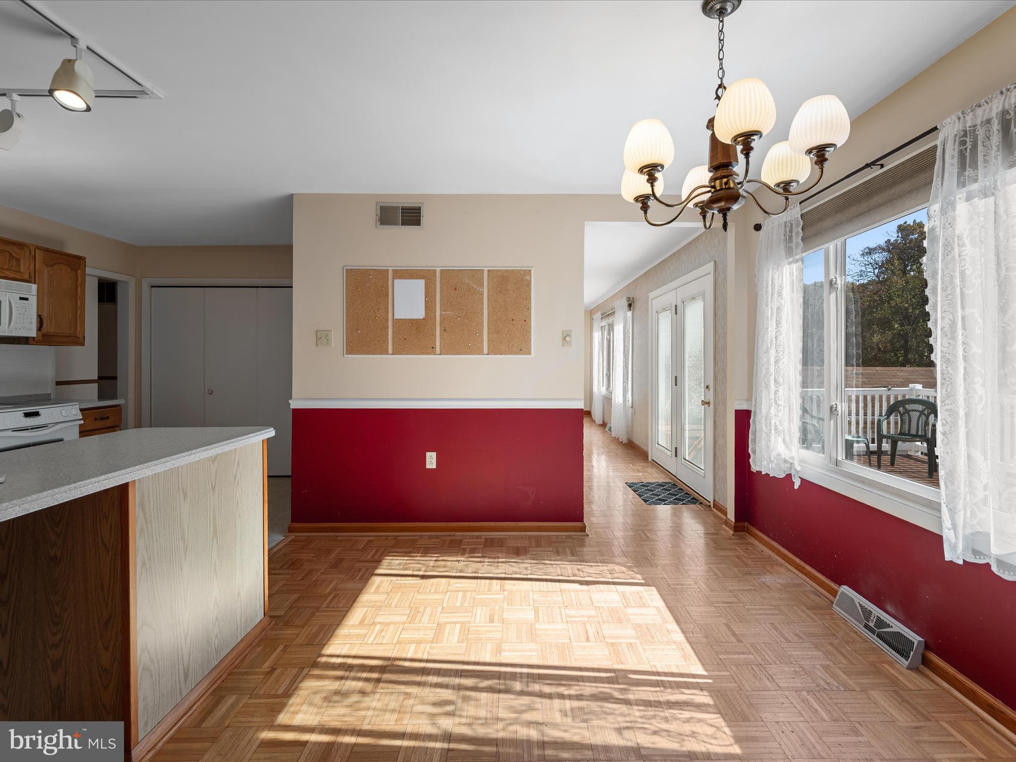 128 Longcroft Road Winchester, VA 22602 - Photo 13 of 41 a view of lobby with a couch and a chandelier