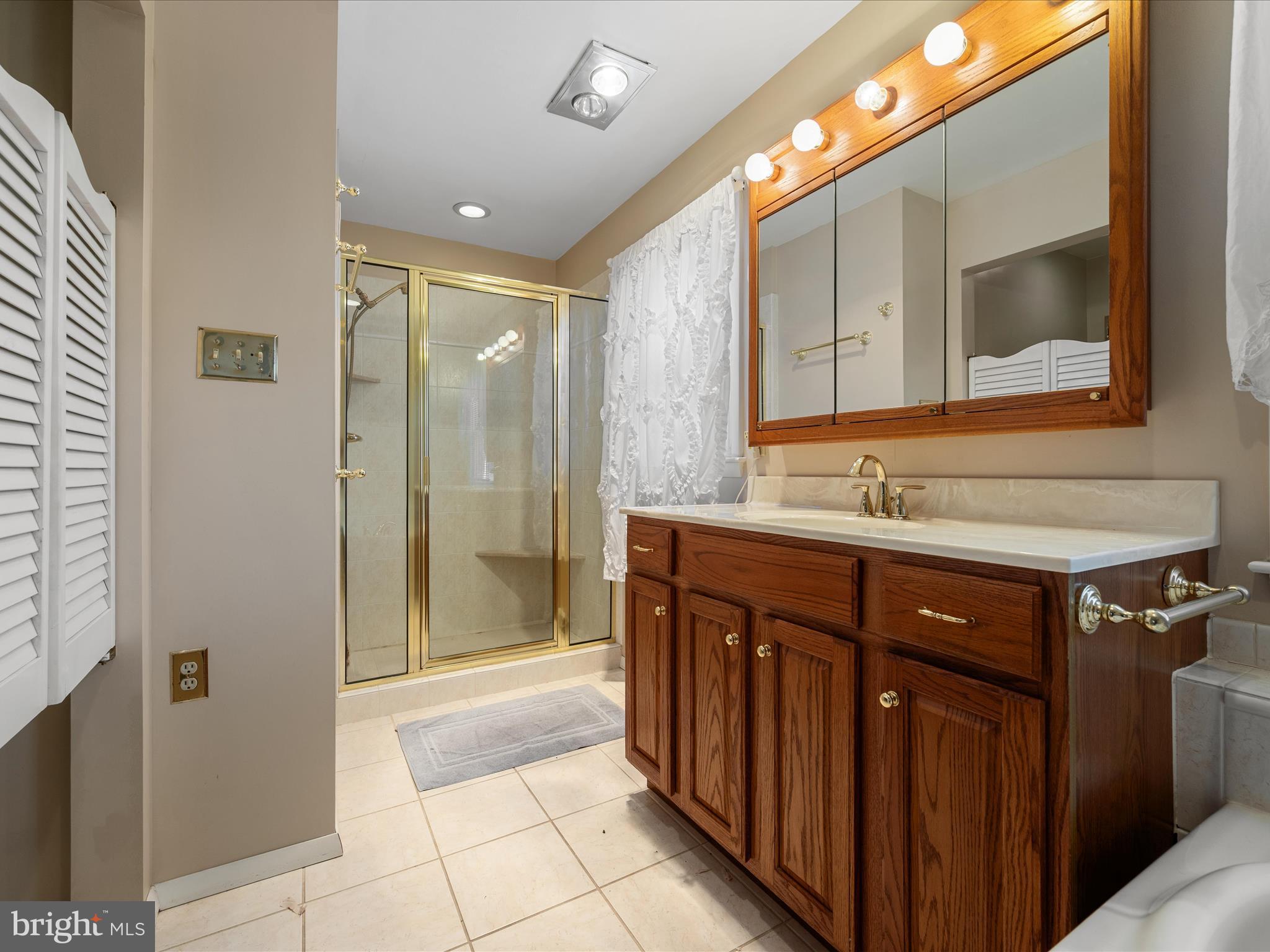 128 Longcroft Road Winchester, VA 22602 - Photo 24 of 41 a bathroom with a sink vanity and a mirror