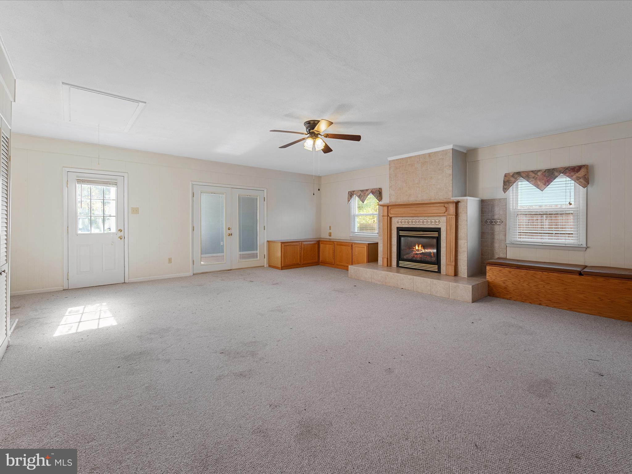 128 Longcroft Road Winchester, VA 22602 - Photo 5 of 41 an empty room with furniture and a fireplace