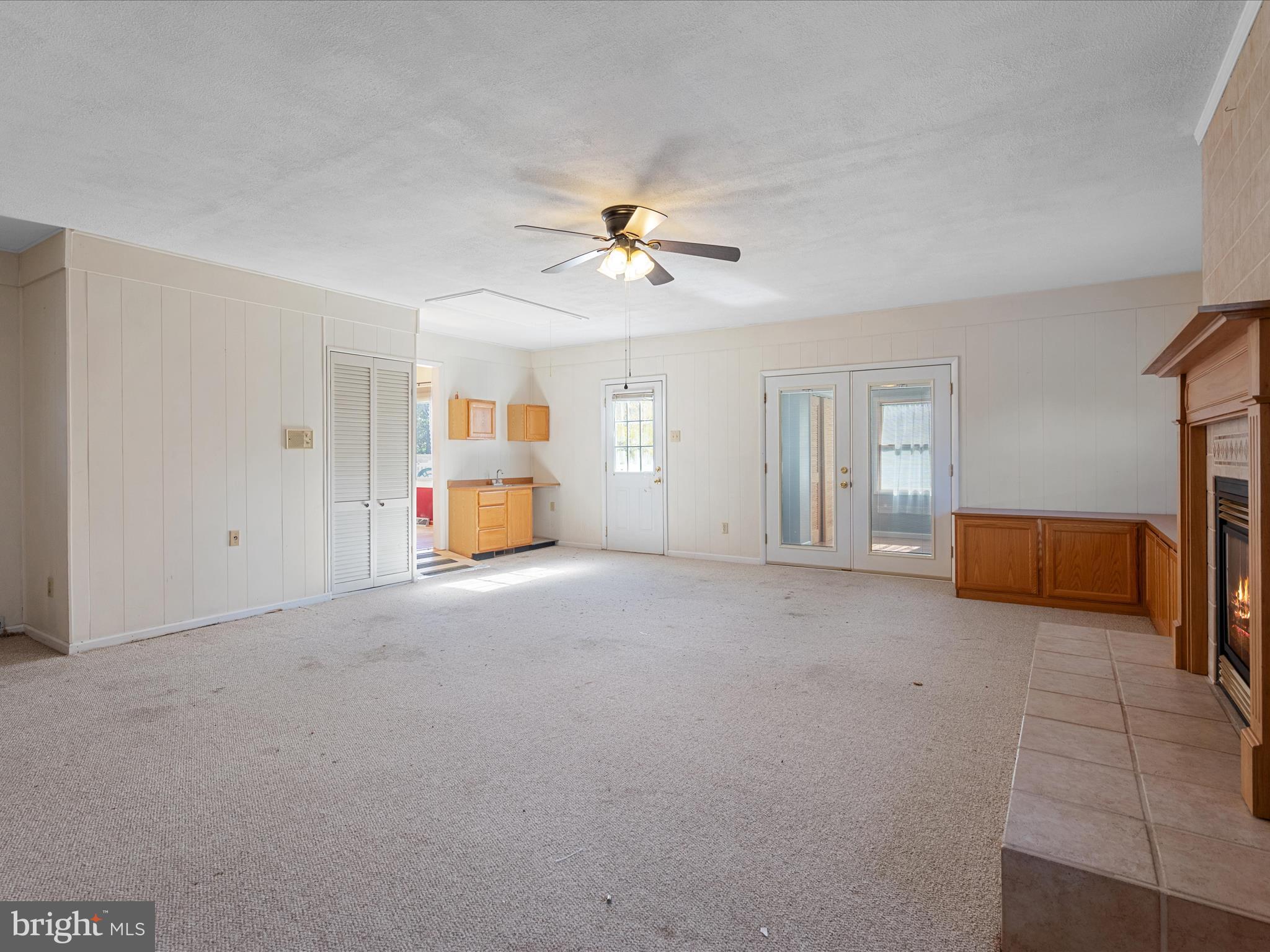 128 Longcroft Road Winchester, VA 22602 - Photo 6 of 41 a living room with furniture and a chandelier