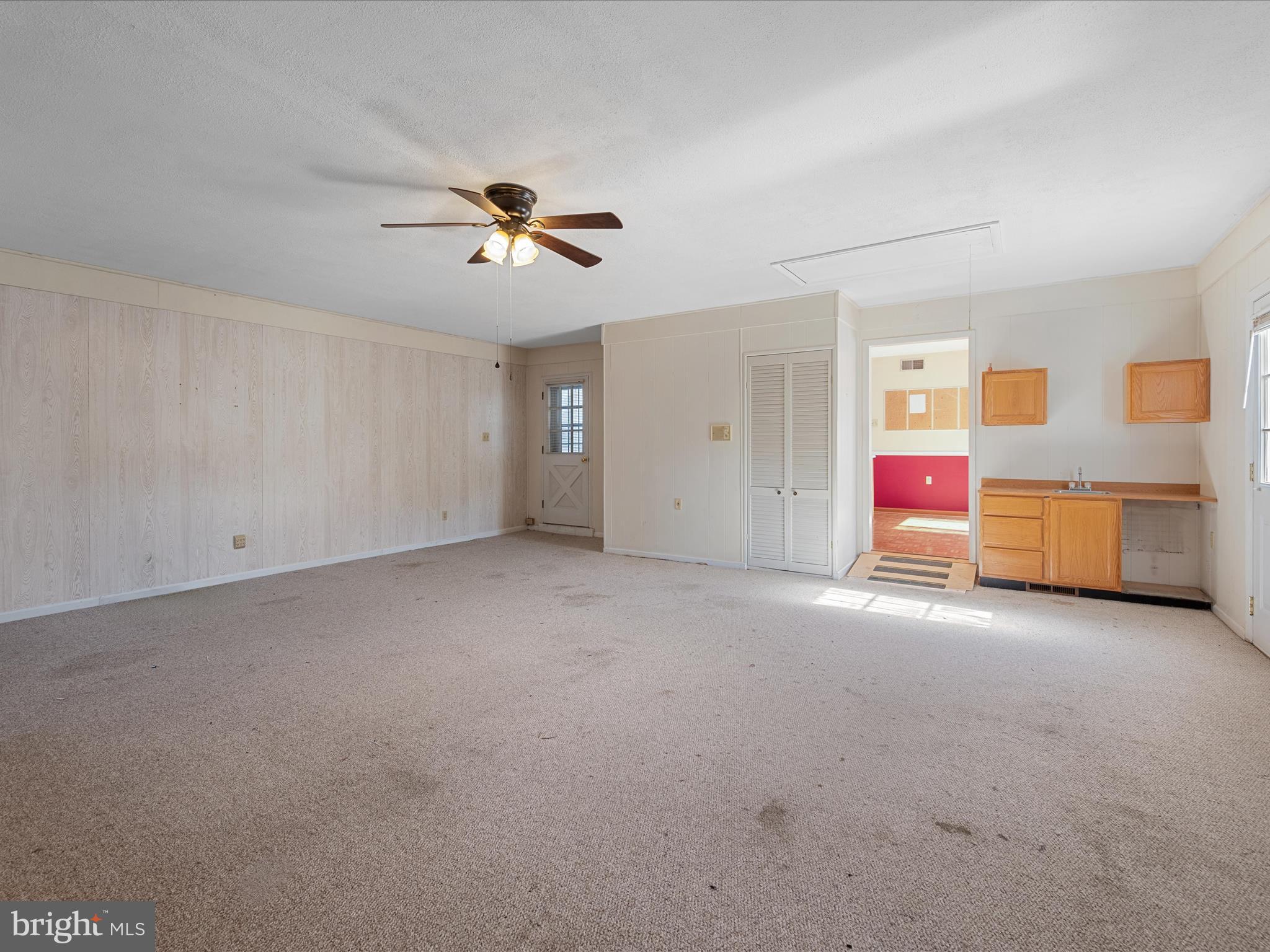 128 Longcroft Road Winchester, VA 22602 - Photo 7 of 41 an empty room with windows and cabinet