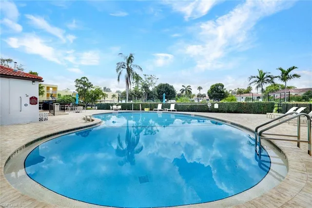 a view of a park with slide on table and chairs