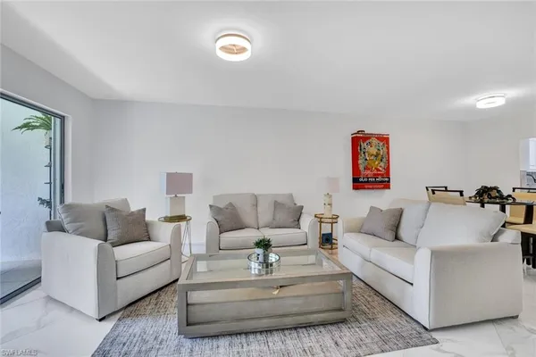 a living room with furniture and a couch