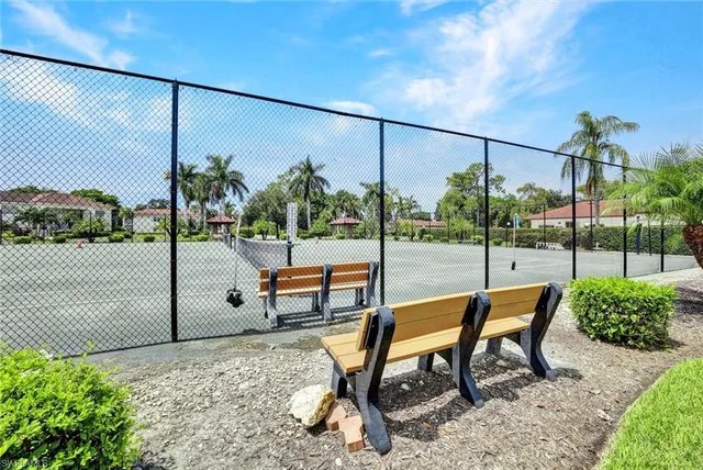 a view of a swimming pool with a lounge chair