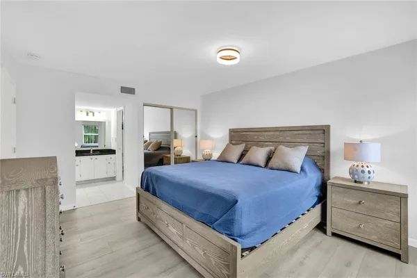 a bedroom with a bed and a dresser