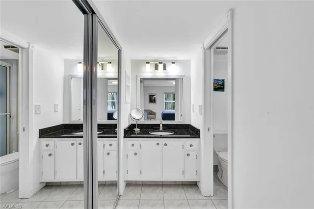 a bath room with a sink and a mirror