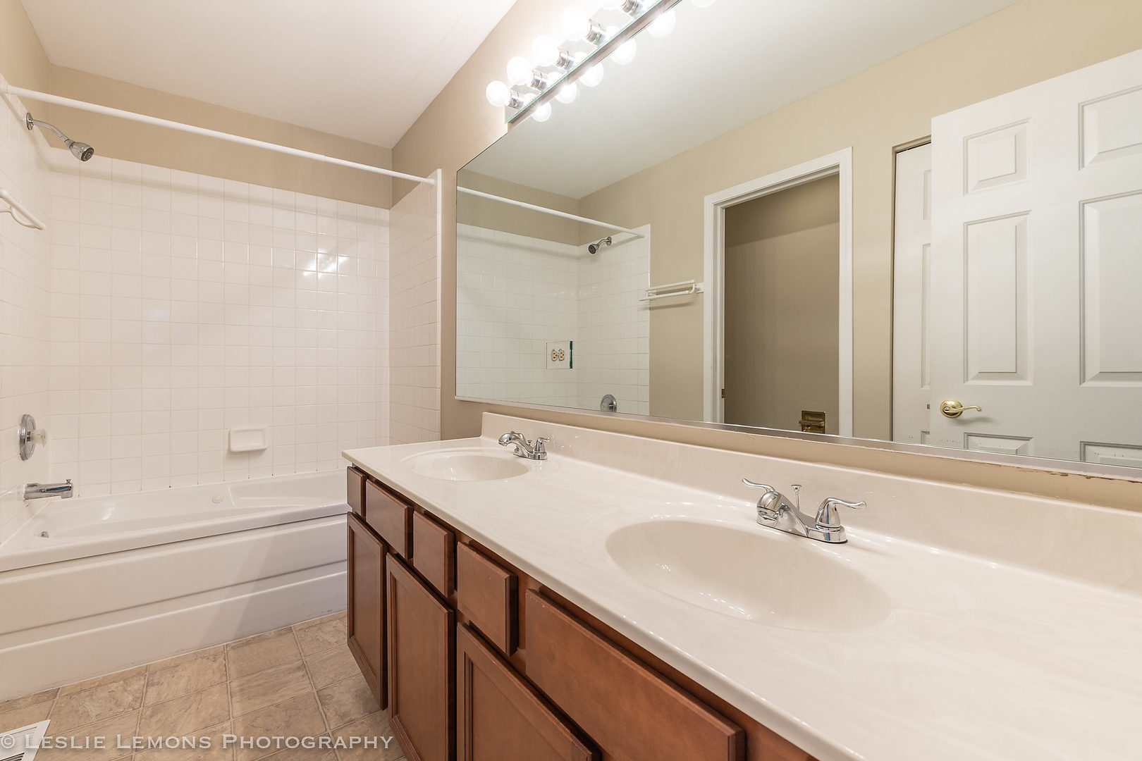956 Pin Oak Circle Cary, IL 60013 - Photo 28 of 31 a bathroom with a sink double vanity granite tub shower and a mirror