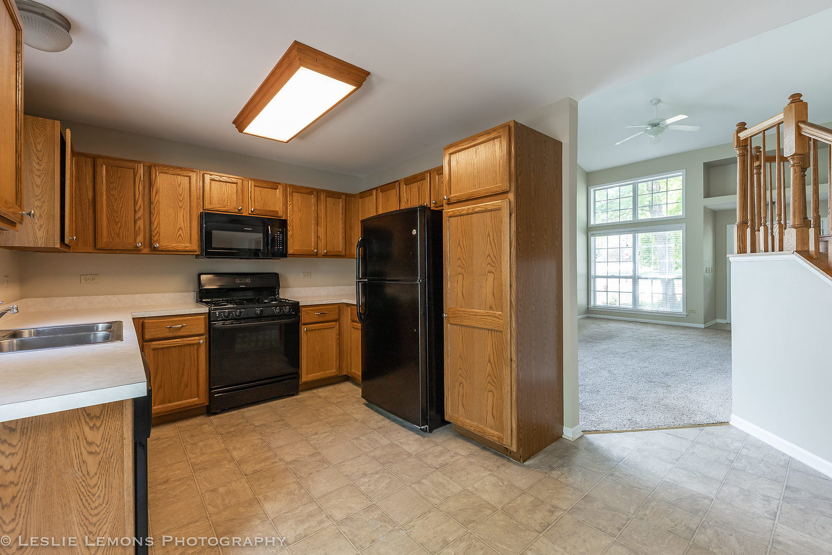 956 Pin Oak Circle Cary, IL 60013 - Photo 7 of 31 a kitchen with stainless steel appliances granite countertop a refrigerator stove and microwave