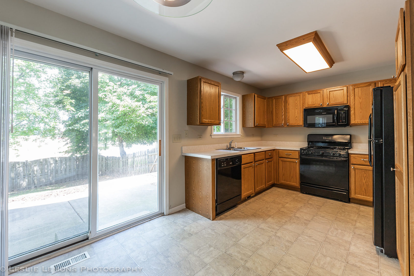 956 Pin Oak Circle Cary, IL 60013 - Photo 8 of 31 a kitchen with a stove a sink and a refrigerator