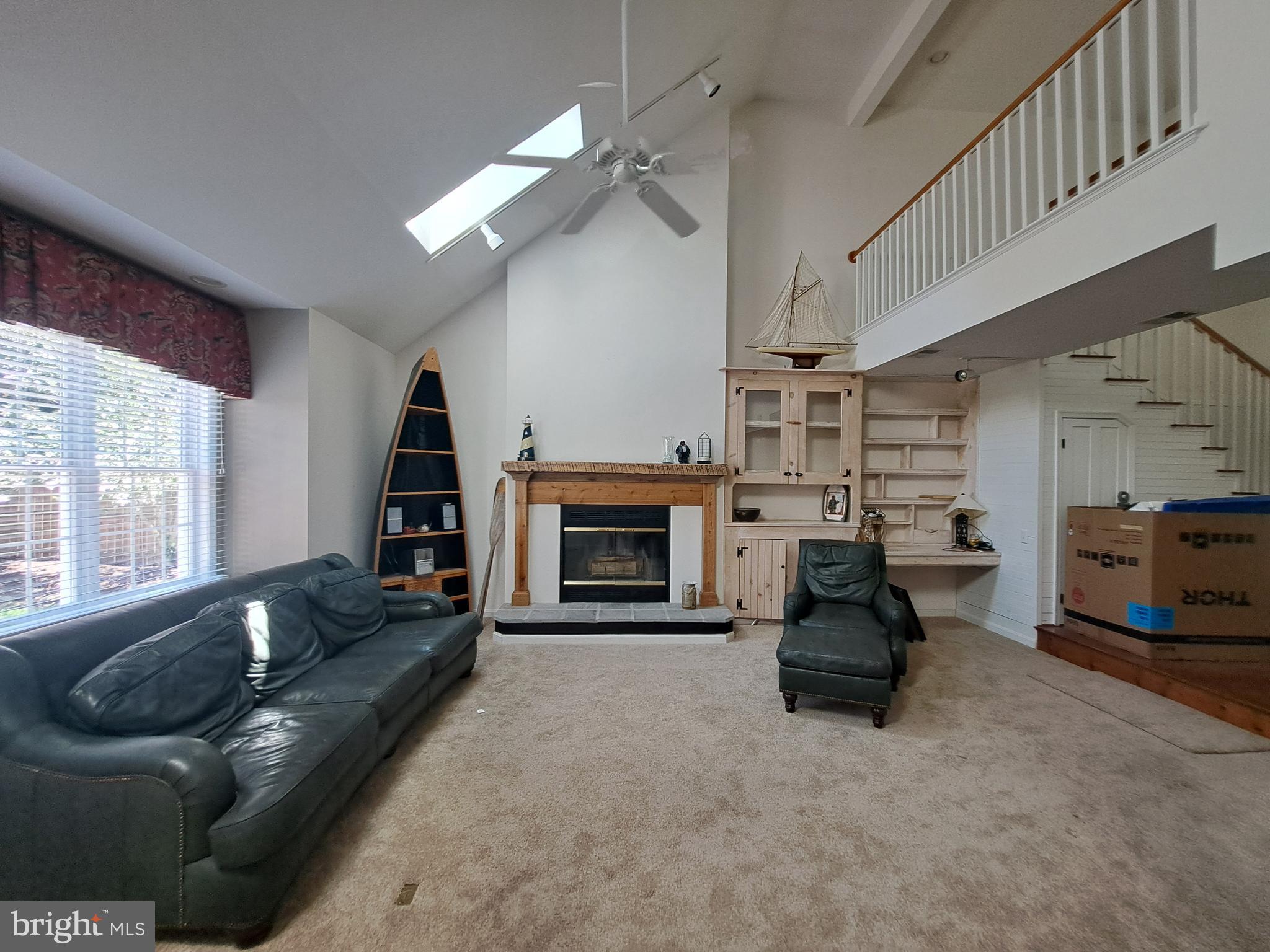 123 New Road Lewes, DE 19958 - Photo 10 of 29 a living room with furniture and a fireplace