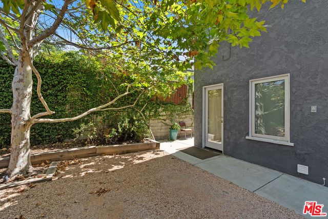 a view of a house with a tree