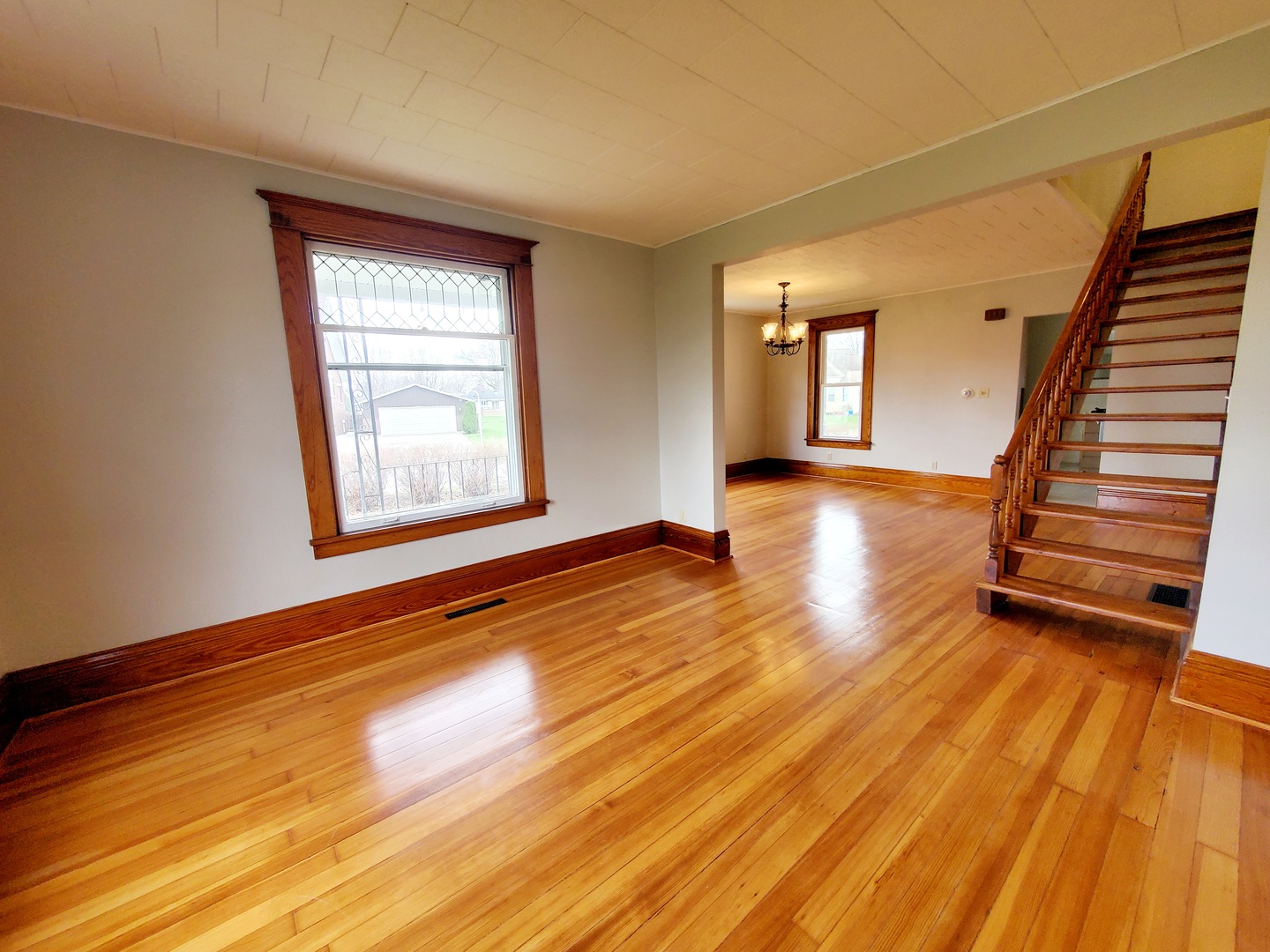 301 2nd Street Danforth, IL 60930 - Photo 6 of 50 an empty room with wooden floor and windows