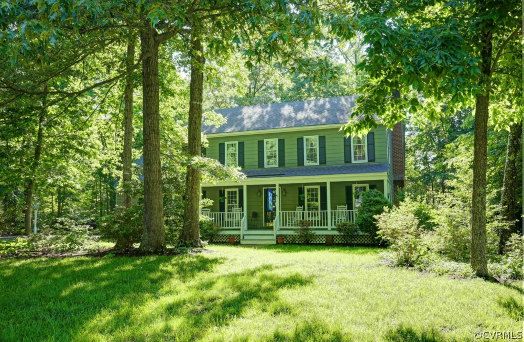 front view of a house with a garden