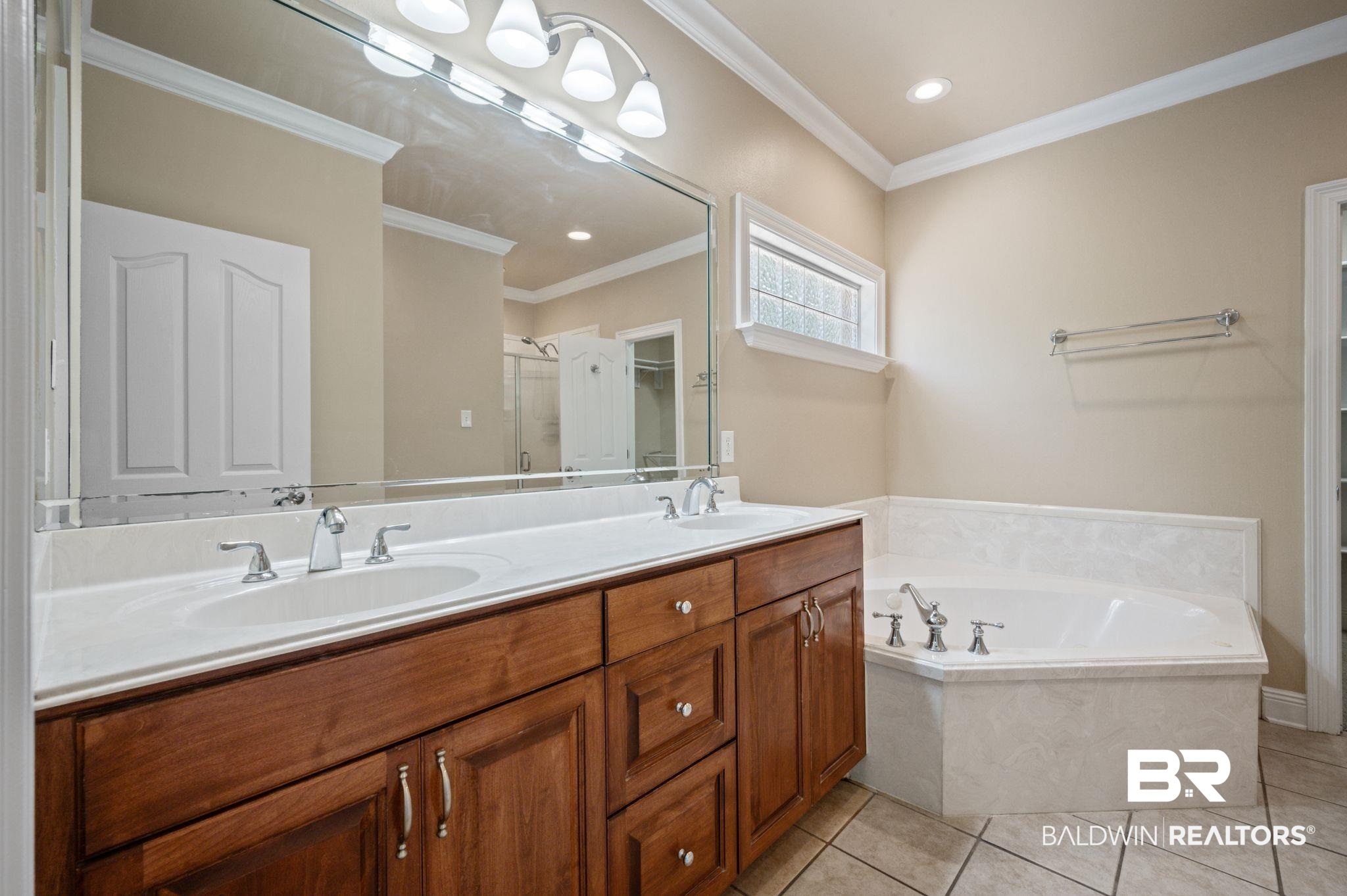 2041 Ridgeline Drive Mobile, AL 36695 - Photo 14 of 43 Bathroom with crown molding, tile patterned flooring, a bath, and dual bowl vanity