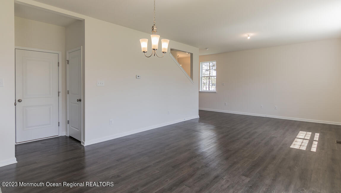 35 Phoebe Drive Barnegat, NJ 08005 - Photo 2 of 21 an empty room with wooden floor and windows