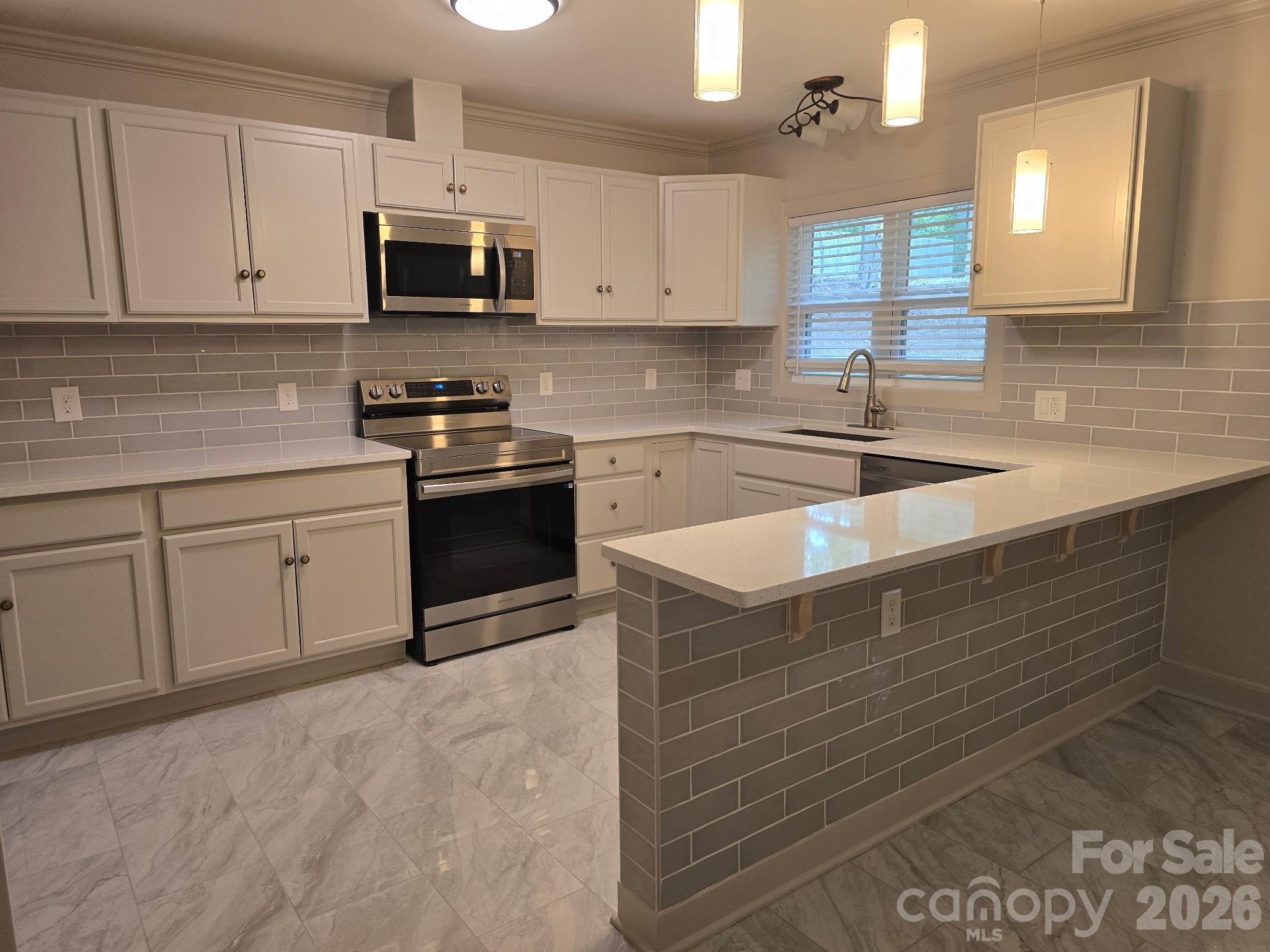 126 Sunset Drive Chester, SC 29706 - Photo 6 of 31 a kitchen with stainless steel appliances granite countertop a sink and a stove