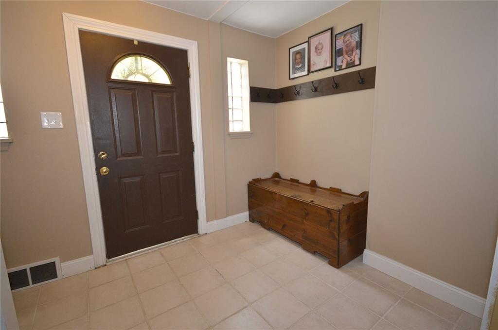 Spacious entryway welcomes you into the home which features a neutral color scheme throughout.