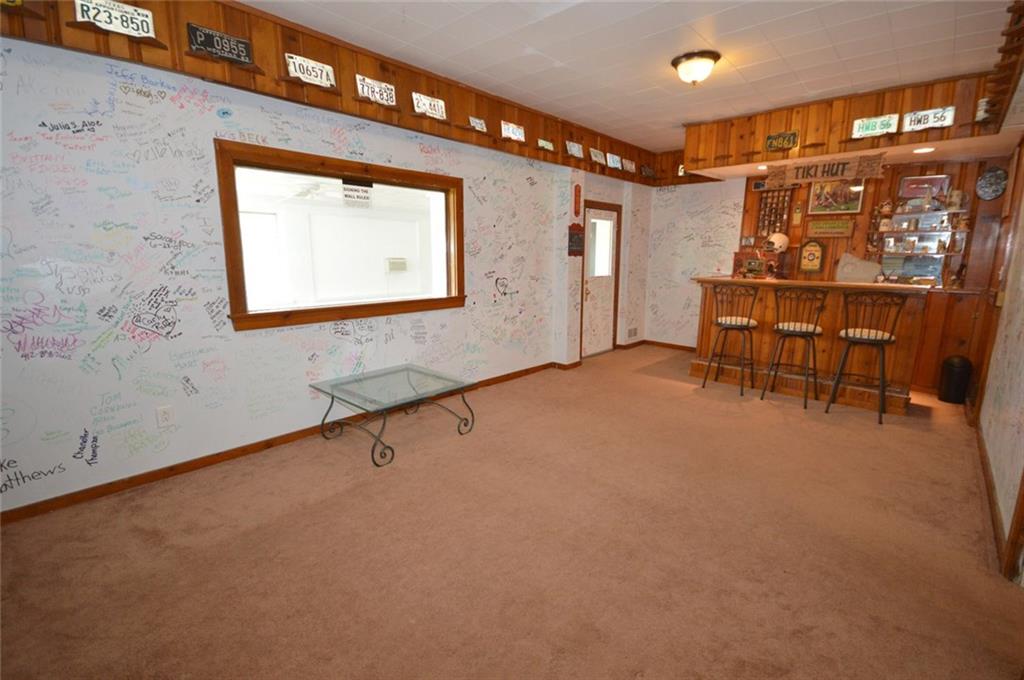 306 Old Lesnett Road Pittsburgh, PA 15241 - Photo 15 of 24 Basement gameroom is ready and waiting for you to host any event. At 24x12, the gameroome can accomodate lots of guests and the built-in bar is a real bonus. Need more space? Just open the door and step into the 26x13 Sunroom!