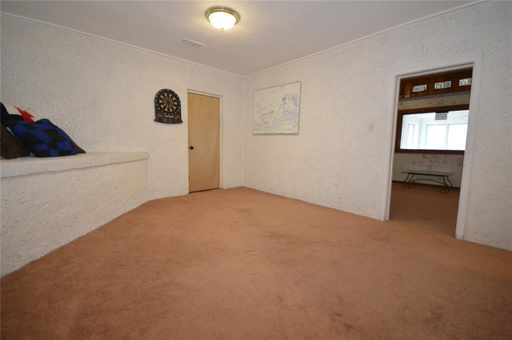 306 Old Lesnett Road Pittsburgh, PA 15241 - Photo 17 of 24 Great flex space just off the gameroom in the basement. So many possible uses! Door leads to still another large room with walk out access to the backyard! Rooms are 18x11 and 26x13.
