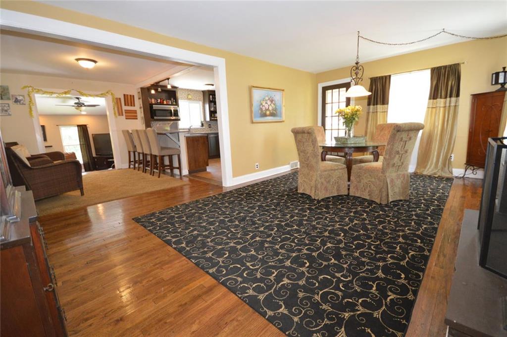 Dining Room is 20x12 and features hardwood floors, fireplace and french door to covered patio.  