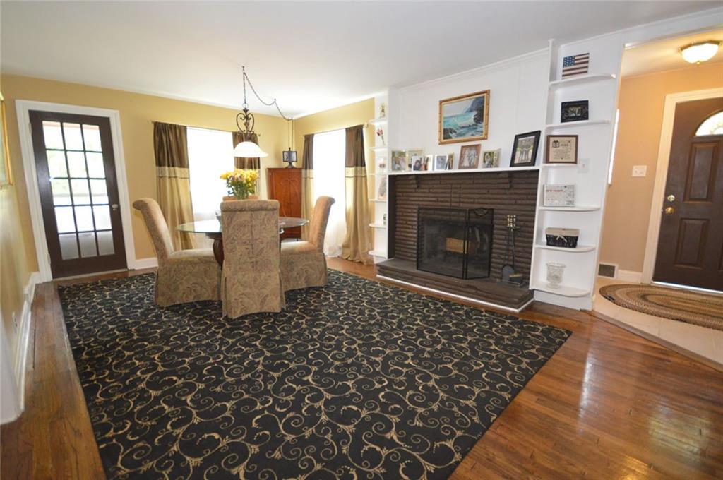 So many charming details in this home!  Built in bookshelves and lots of light.