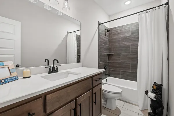 a view of white house with a yard covered with snow