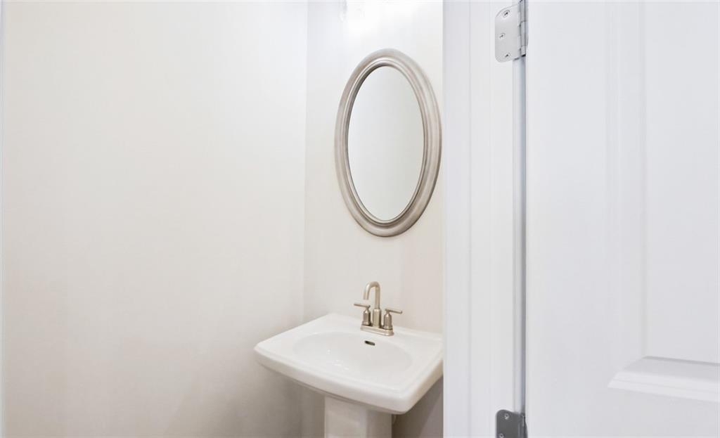 726 Stickley Oak Way Woodstock, GA 30189 - Photo 14 of 40 a bathroom with a sink and a mirror