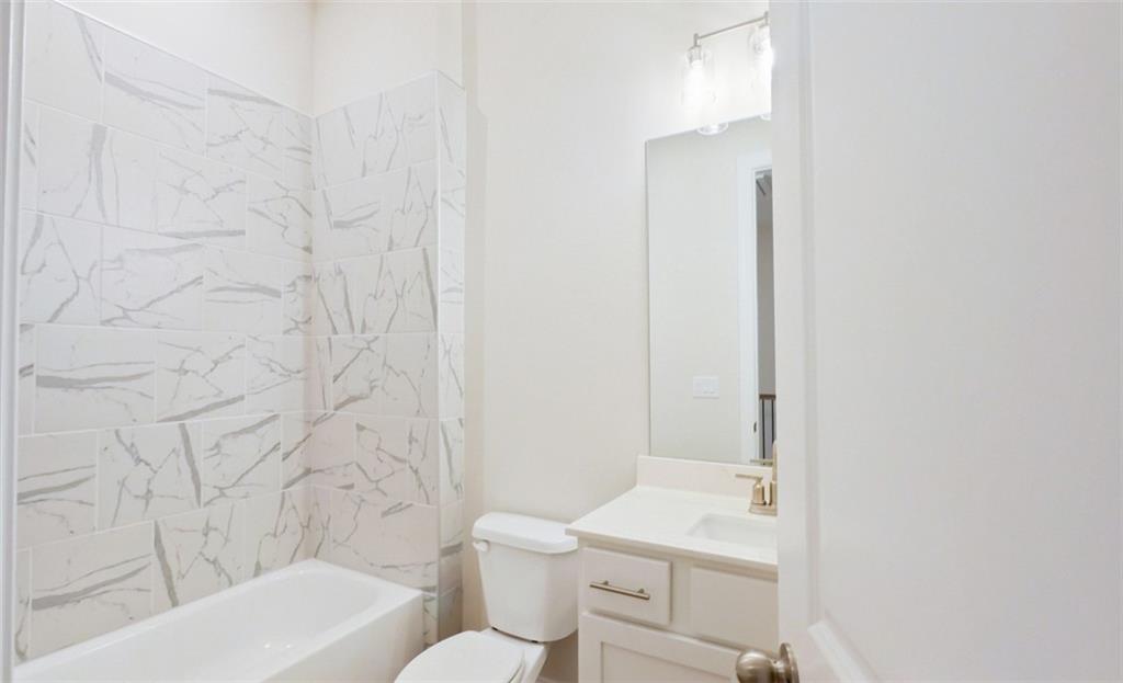 726 Stickley Oak Way Woodstock, GA 30189 - Photo 28 of 40 a bathroom with a sink toilet and shower