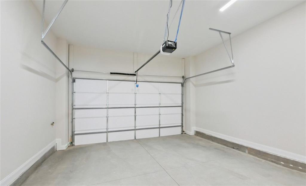 726 Stickley Oak Way Woodstock, GA 30189 - Photo 30 of 40 a view of a room with racks on the wall