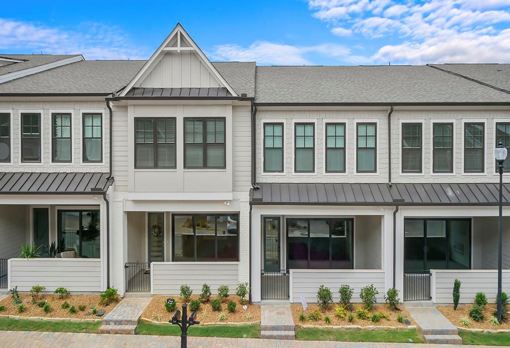 726 Stickley Oak Way Woodstock, GA 30189 - Photo 3 of 40 front view of a brick house with a yard