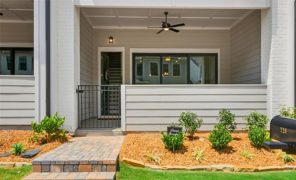 726 Stickley Oak Way Woodstock, GA 30189 - Photo 5 of 40 a front view of a house with garden