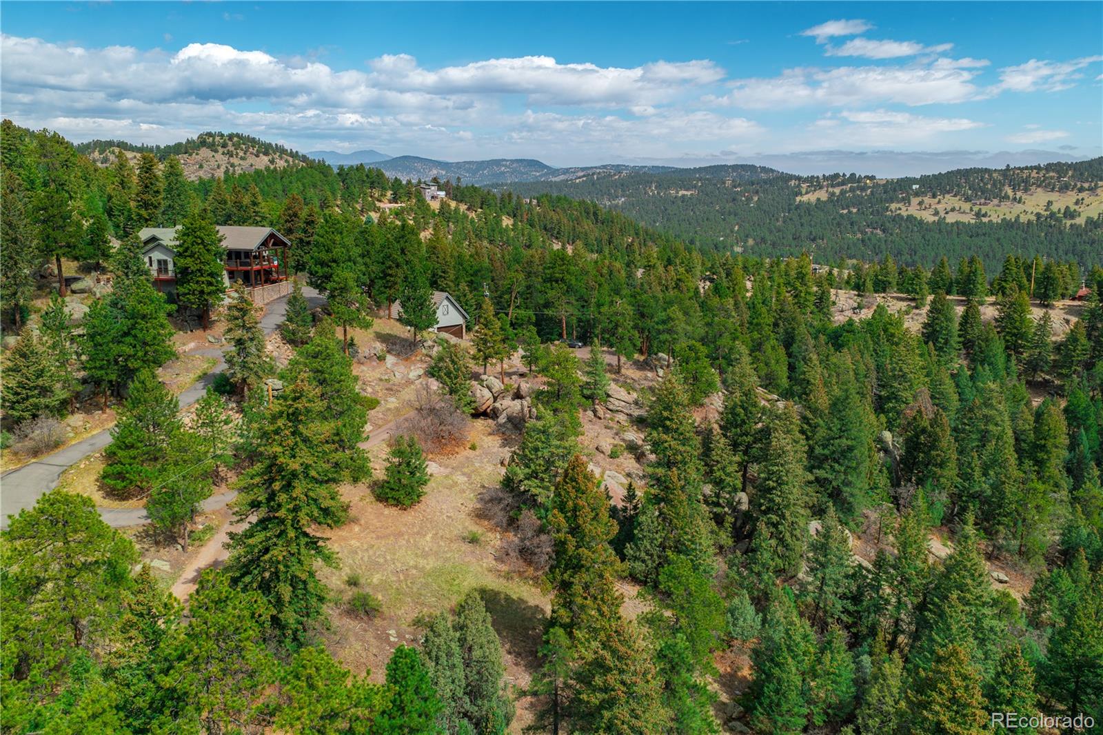 22668 Shawnee Road Indian Hills, CO 80454 - Photo 13 of 21 a view of a lake with a city
