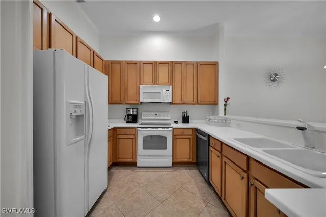a view of a storage & utility room with two washing machine